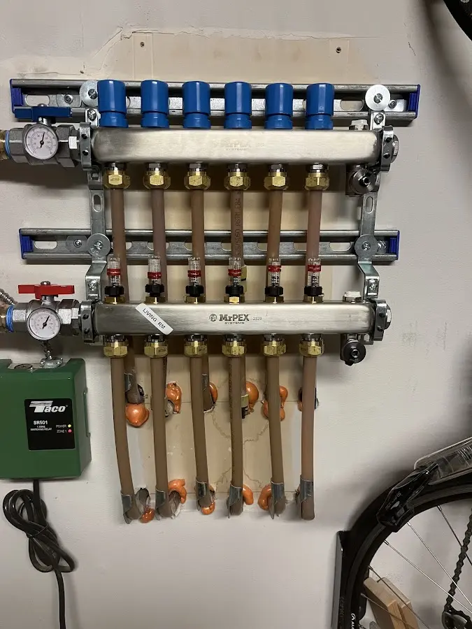 Plumber performing Water Heater Repair at a residential property in Caledonia