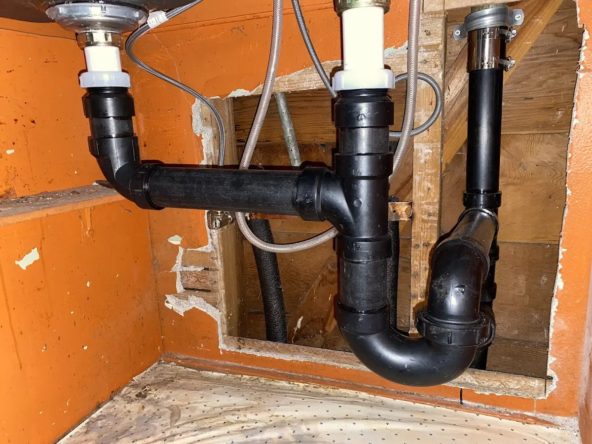 Professional Garbage Disposal Repair equipment and tools on the job in Caledonia